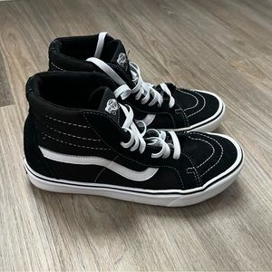 Vans 9 1/2 Black and White High top Sneaker.